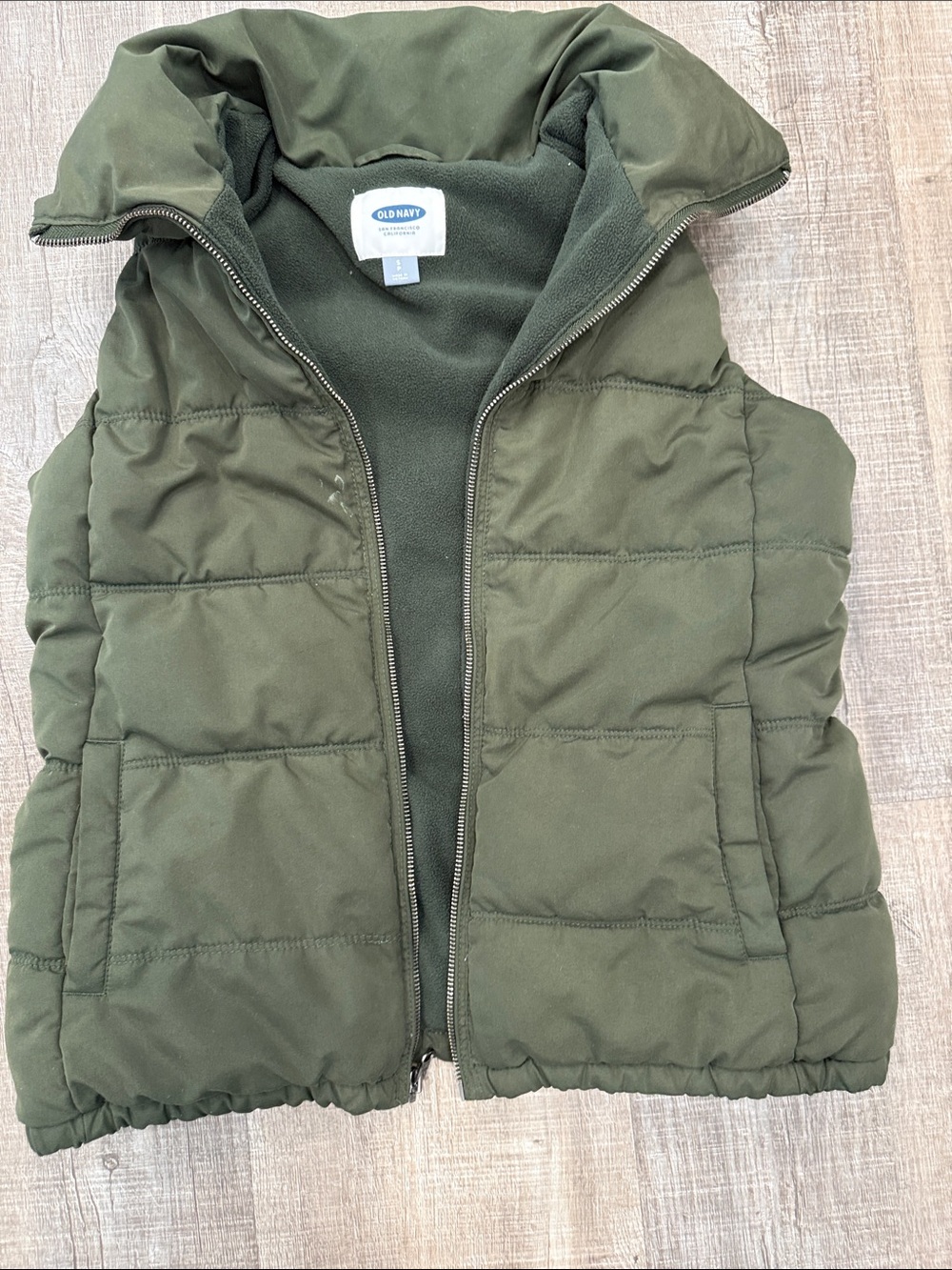 Old Navy puffer vest. Olive green with front zipper size Small adult